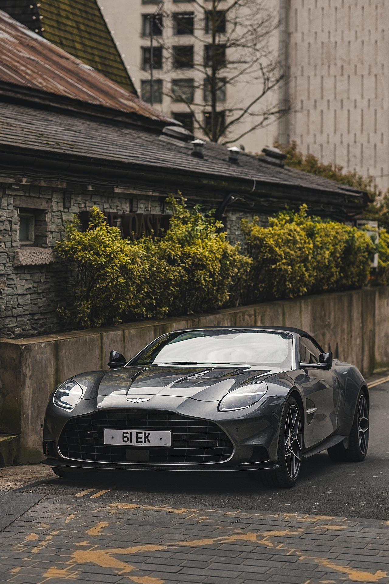 aston martin parked on the street in manchester