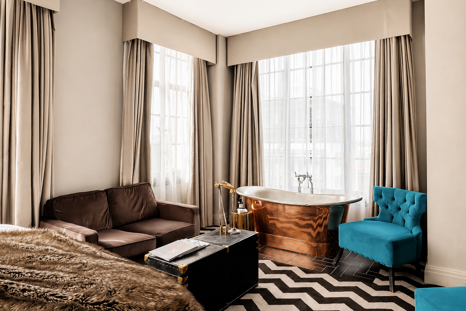 the rex hotel manchester bedroom with a bath tub